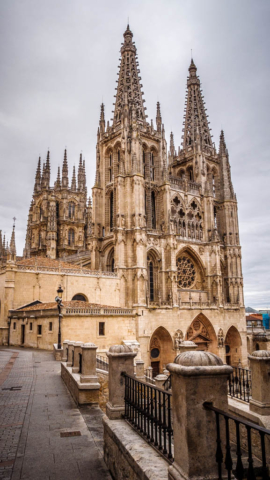 One of the main cities on the Camino after Pamplona and the Riojan capital of Logroño is Burgos. Pilgrims walking through the castle-like main entrance to the Old Town and onto the main plaza, with a spectacular view of the cathedral will be forgiven for feeling a little awestruck.  This major Gothic wonder is recognised by UNESCO and is located in Burgos, Castilla y León, Spain. Building of Burgos Cathedral began in 1221 and wasn’t completed until 1567. It is a stunning example of Gothic art throughout, from its exterior architecture through to the interior stained glass window, choirs stalls and paintings. The ground plan of the magnificent building is inspired by the proportions of a Latin cross and represents the Gothic style of northern France.  The cathedral was put on hold from the end of the 13th century until the middle of the 15th century. During the next 100 years, architect Juan de Colonia and his son Simon worked on the front facing towers, spires and the interior chapels, while Felipe de Borgoña overlooked the choir stalls, cupola and lantern tower. The staircase of Diego de Siloe; the tomb of Bishop Alonso de Cartagena, featuring Limoges goldsmith work; and the tomb of El Cid, as well as the resting places of Castille´s monarchy are some of the highlights of this internationally recognised example of European Gothic style.